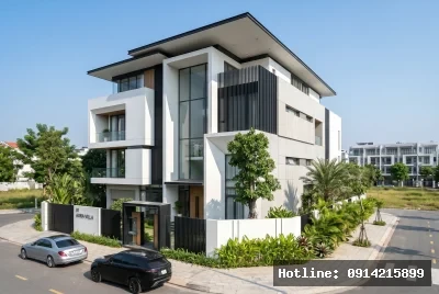 Góc nhìn 3/4 từ trái sang phải | Công trình sử dụng vật liệu chủ yếu là kính và bê tông, mang lại cảm giác hiện đại và mở rộng. Phong cách kiến trúc tối giản với các đường nét vuông vức và màu sắc trung tính tạo nên sự tinh tế và thanh lịch. Ánh sáng tự nhiên tràn ngập không gian, kết hợp với cây xanh xung quanh tạo ra một cảm giác hài hòa và dễ chịu.